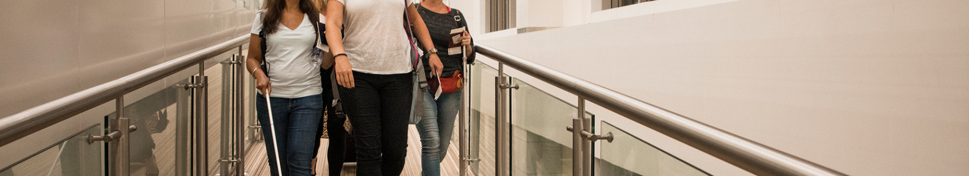 visually impaired people walking down ramp